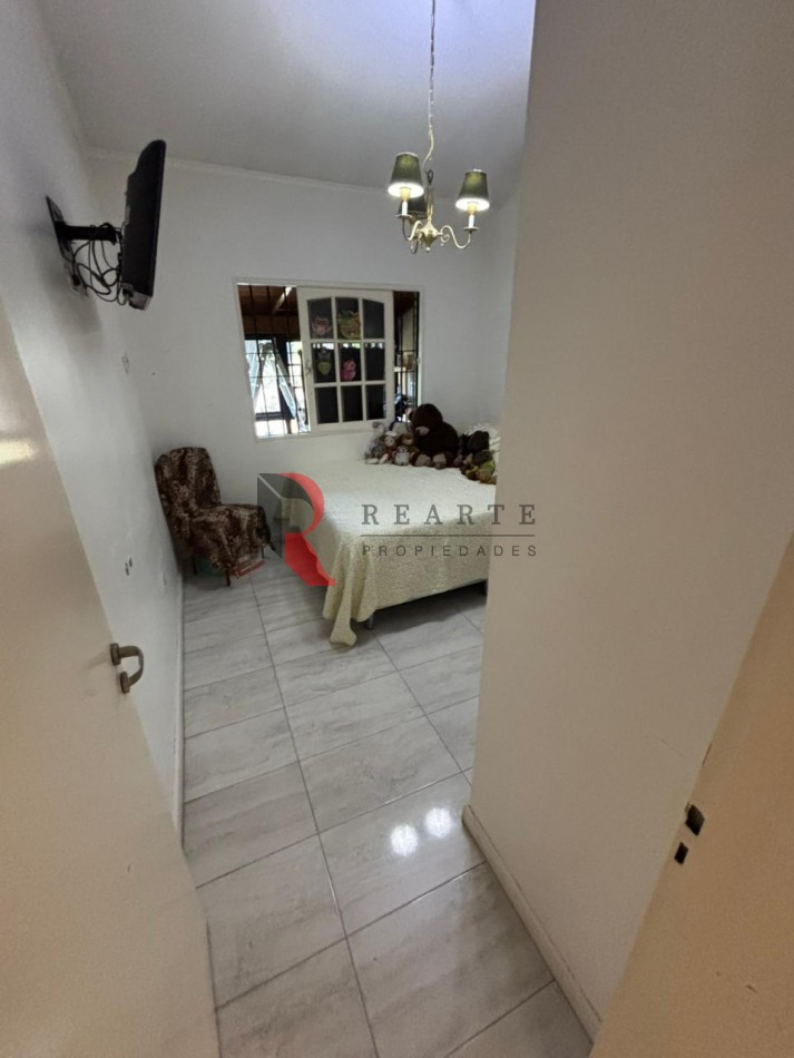 CASA 3 AMBIENTES CON COCHERA Y PATIO EN VENTA 